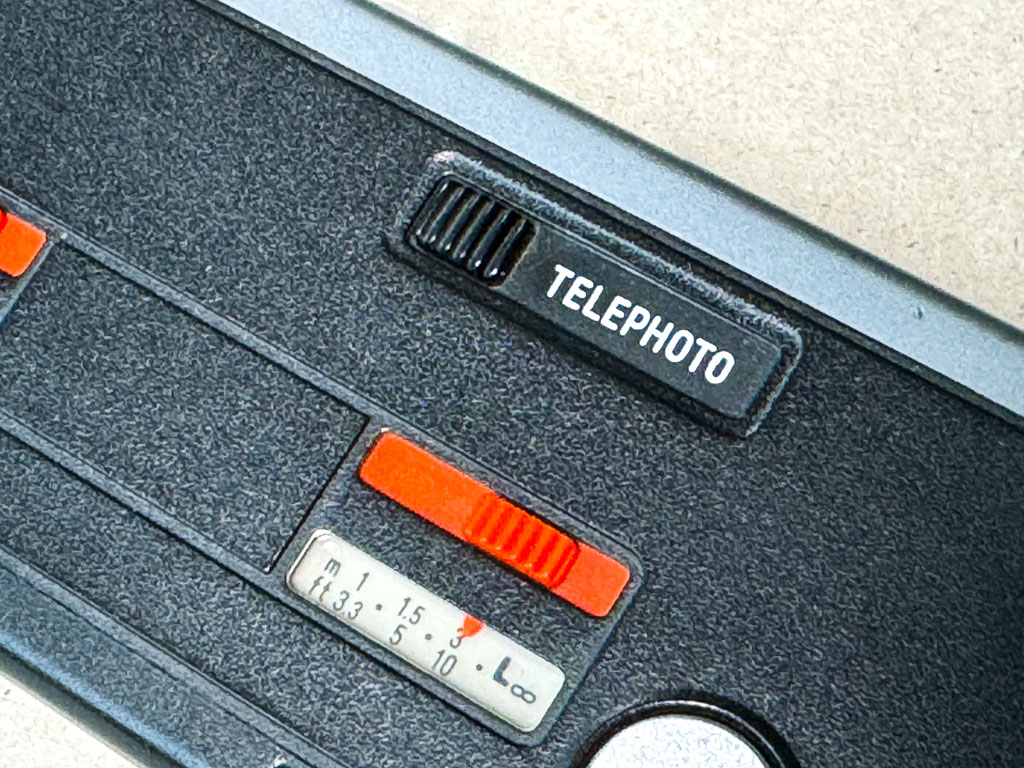 Minolta Autopak 460Tx: Objektivwahlschieber und Distanzeinstellung